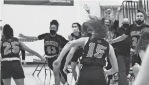  ??  ?? Verona players celebrate after defeating Arrowhead, 50-40, in double overtime of a sectional final on Saturday.