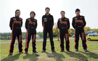  ??  ?? Pan Yongyong (center) and his FCACA team members