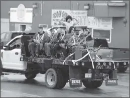  ?? Photo by Diana Haecker ?? CHILLY PARADE— Although snow flurries came down, 2023 NomeBeltz graduates braved the chilly temperatur­es and even flexed bare muscles as they were paraded through town on graduation day, Tuesday, May 16.