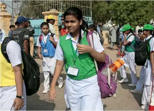  ?? AP ?? Girls leave their school in Karachi on Tuesday. Human Rights Watch has released a 111-page report that said millions of girls in Pakistan are still out of school, mostly because the government spends less money on education. —