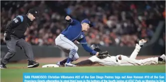  ?? AFP ?? SAN FRANCISCO: Christian Villanueva #22 of the San Diego Padres tags out Alen Hanson #19 of the San Francisco Giants attempting to steal third base in the bottom of the fourth inning at AT&T Park on Monday in San Francisco, California. —