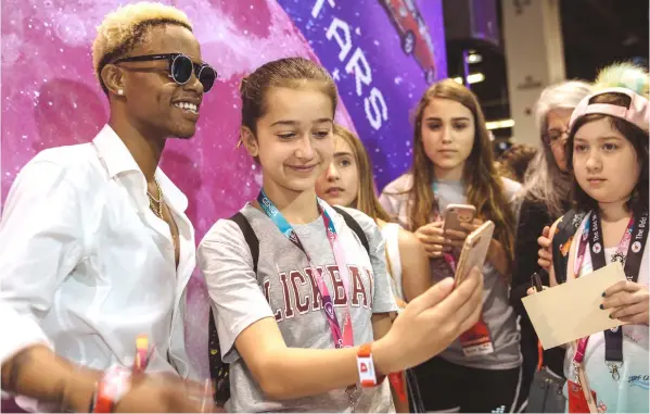  ??  ?? Richard Lamar Hawk, 19, aka the rapper Silentó, meets fans at VidCon. — Photos for The Washington Post by Jessica Pons