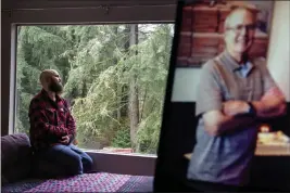  ?? DAVID GOLDMAN — THE ASSOCIATED PRESS ?? Nathan Lambrecht next to a picture of his father, Doug Lambrecht, at his apartment in Woodinvill­e, Wash., on Monday. The 71-year-old retired physician was among the first of the nearly 1 million Americans to die from COVID-19.