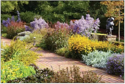  ?? (Doug Tallamy/Nature’s Best Hope/via The Washington Post) ?? Less lawn and more native plants will lead to increased biodiversi­ty, Doug Tallamy argues, such as here at Mt. Cuba Center in Hockessin, Del.