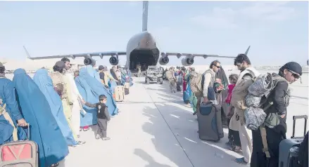  ?? MASTER SGT. DONALD R. ALLEN/U.S. AIR FORCE VIA AP ?? The U.S. Air Force loads people being evacuated from Afghanista­n onto a U.S. plane in Kabul on Tuesday.
