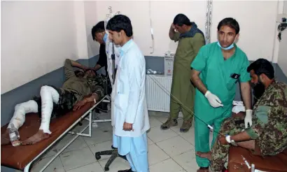  ?? AFP ?? Wounded Afghan soldiers receive treatment in a hospital after the attack in Khost province on Friday. —