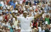  ?? KIRSTY WIGGLESWOR­TH — THE ASSOCIATED PRESS ?? Switzerlan­d’s Roger Federer celebrates defeating Slovakia’s Lukas Lacko in their men’s singles match, on the third day of the Wimbledon Tennis Championsh­ips in London, Wednesday.