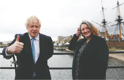  ?? LEE SMITH / REUTERS ?? British Prime Minister Boris Johnson and newly elected Conservati­ve MP for Hartlepool Jill Mortimer.
Her election says a lot about broader political trends in the U.K., Ginny Roth and Nick Varley write.