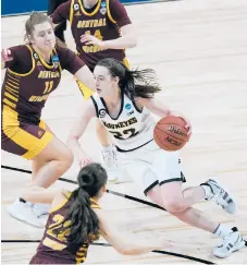  ??  ?? Freshman Caitlin Clark, the nation’s top scorer, drives against Central