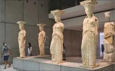  ??  ?? People visit the Athens Acropolis Museum during the first day of the opening, yesterday.