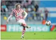  ?? FOTO: AFP ?? Rot-weißes Schachbret­t: Kroatiens Luka Modric.