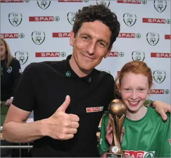 ??  ?? Ciara Brennan presented with the Player of the Tournament award by Keith Andrews, SPAR FAI Primary School 5s Programme ambassador and former Republic of Ireland Internatio­nal. Pic: Cody Glenn/Sportsfile
