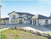  ??  ?? Arches lend a stately feel to this home by Versa Platinum Constructi­on in Langley, which features high ceilings and an airy, open floor plan.