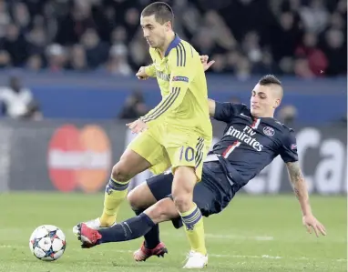  ?? REUTERS ?? BRUTAL: Paris St Germain's Marco Verratti launches himself into another challenge on Chelsea's Eden Hazard during their Champions League clash at the Parc des Princes Stadium in Paris on Tuesday night