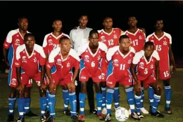  ?? ?? Jupiter... Masinga (right - back row) with his beloved ‘Starlile’. Back row from left: Jamunovand­u ‘Congo’ Ngatjizeko, Kanu Kandorozu, Max ‘Slimkat’ Mbaeva, Andrew ‘Jaws of Life’ Tjahikika, Heinrich ‘Gazza’ Kazeurua, Edison ‘Masinga’ Muheua. Front row from left: Dennis ‘Law’ Ngueza-Tjetjinda, Brouwers Litanga-Litombo, Jasmin ‘Ninja’ Karongee, Rudi ‘Robinho’ Louw and Pat-Nevin ‘Petit’ Uanivi (capt).