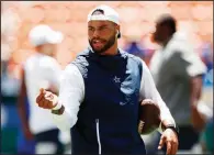  ?? AP/MARCO GARCIA ?? Dallas Cowboys quarterbac­k Dak Prescott is in the middle of contract negotiatio­ns with the team. Former Cowboys fullback Daryl Johnston has a message for Prescott. “The [six] highest-paid quarterbac­ks in the NFL last year weren’t in the playoffs. None of them,” Johnston said.