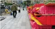  ?? Photo: AP ?? Barricades are stacked up as restrictio­ns ease in Guangzhou.