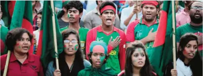  ??  ?? DHAKA: Bangladesh­i cricket fans attend a rally as a show of support to their national team at the Dhaka University Campus yesterday. Bangladesh play the World Cup quarterfin­al match against India today. —AP