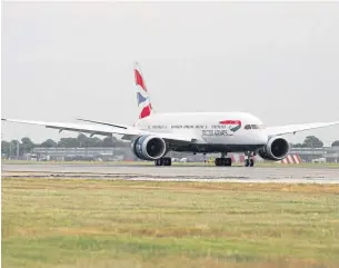  ??  ?? A Boeing 787 Dreamliner touches down at London Heathrow.