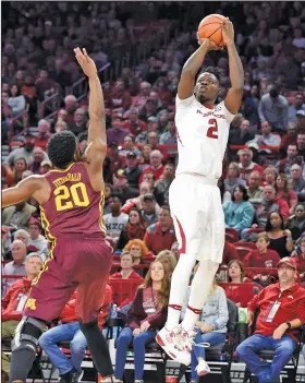  ?? Craven Whitlow/Special to the News-Times ?? Taking aim: Arkansas' Adrio Bailey takes a jump shot during the Razorbacks' contest against Minnesota last season. Along with former El Dorado standout Daniel Gafford, Bailey is being counted on as one of the few holdovers from last year's squad that...