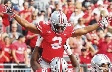  ?? DAVID JABLONSKI/STAFF ?? J.K. Dobbins is the clear projected starter at running back after Mike Weber decided to test the NFL waters. Behind him, Demario McCall headlines a host of Buckeyes looking to make a push in 2019.