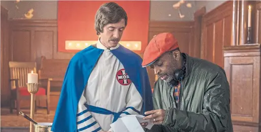  ?? DAVID LEE THE ASSOCIATED PRESS ?? Topher Grace, left, with director Spike Lee on the set of BlacKkKlan­sman. Peter Howell forecasts the film will win Best Adapted Screenplay.