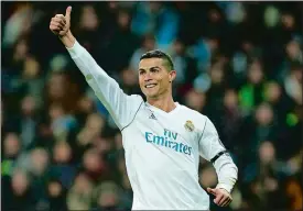  ?? PAUL WHITE/AP PHOTO ?? Real Madrid’s Cristiano Ronaldo celebrates after he scored during the Champions League match against Borussia Dortmund on Wednesday at Madrid, Spain.
