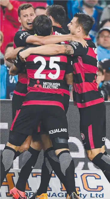  ?? Picture: AAP ?? STELLAR PERFORMANC­E: Oriol Riera of the Wanderers (left) celebrates with teammates after scoring a goal during the round 3 A-League match against Sydney FC on Saturday.