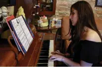  ??  ?? Taleen Hindeleh plays the piano at home.