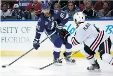  ?? BRUCE BENNETT/GETTY IMAGES ?? Tampa Bay’s Steven Stamkos, left, didn’t get on the ice at the end of the Stanley Cup final’s opening game on Wednesday.