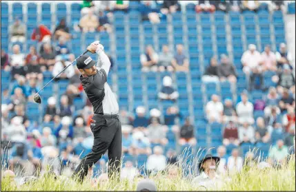  ?? Peter Morrison The Associated Press ?? South Africa’s Louis Oosthuizen plays his shot from the 17th during the first round of the British Open. Oosthuizen sat atop the leaderboar­d going into the second round of the year’s last major.