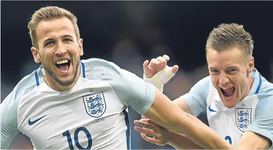  ?? Getty. Picture: ?? Harry Kane, left, celebrates with Jamie Vardy after scoring the opening goal in a friendly against Turkey at the Etihad Stadium last May. This was the Tottenham striker’s last goal for his country.