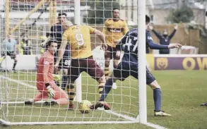  ??  ?? Hearts keeper Jon Mclaughlin was credited with Motherwell’s opening goal.