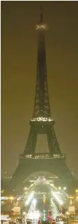  ?? — AFP photo ?? The lights of the Eiffel Tower in Paris are switched off in tribute to the victims of the attacks in Las Vegas and Marseille.