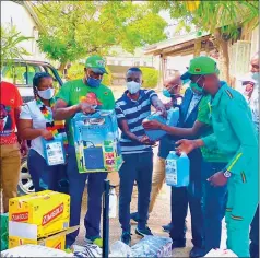  ??  ?? Zanu PF Youth League members led by secretary for indigenisa­tion Cde Mike Chimombe (foreground, right) present their donations at Kariba Hospital last week