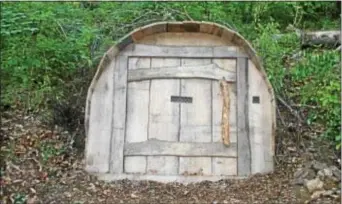  ??  ?? This mysterious door in the woods at Tyler Arboretum inspires budding writers participat­ing in “The Tyler Arboretum Writing Project.”