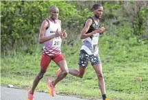  ?? Picture: DEAN VENISH ?? POUNDING THE TAR: Eastern Cape athletes Yanga Malusi (left) and Malixole Kalindeni (right) have the chance to partake in the TCS London Marathon in the UK in April.