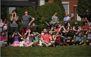  ?? (Arkansas Democrat-Gazette/Staci Vandagriff) ?? Visitors of Lyon College watch the solar eclipse Monday on the campus in Batesville.