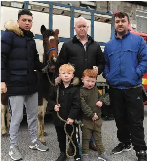  ?? ABOVE: Aoibheann O’Leary (8) beaming clearly with love for her little pony at the Listowel Horse Fair on Thursday. Photos by Domnick Walsh ?? LEFT: James McCarthy (5) has the rein with Charlie O’Brien (3), Mike Walsh, James McCarthy and Jonathan O’Brien.