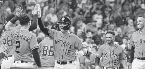  ?? Photos by Steve Gonzales / Staff photograph­er ?? Aledmys Diaz is all smiles after his fifth-inning home run, the sixth for the Astros on Friday night in their 10-2 win over the Seattle Mariners at Minute Maid Park.