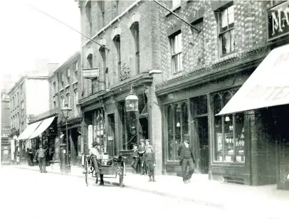  ??  ?? An early photograph dating back to some time during 1910 to 1919 of Macclesfie­ld’s Mill Street, showing The Bible Depot and other shops