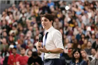  ?? The Canadian Press ?? Prime Minister Justin Trudeau speaks during a town hall Thursday at the University of Regina.