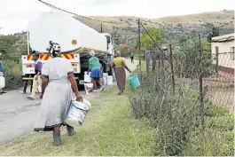  ?? Pictures: JACKIE CLAUSEN ?? BUCKET LIST: Residents in the Smero area of Edendale, Pietermari­tzburg, gather water in buckets from a tanker after having no running water for two weeks