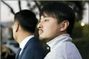  ?? ASSOCIATED PRES FILE PHOTOS ?? Brandon Tsay, right, and his father, Tom Tsay, make a statement outside their home on Jan. 23, in San Marino, Calif.