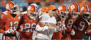  ?? AP file photo ?? Coach Dabo Swinney (middle) and the No. 2 Clemson Tigers would become the first ACC team with four consecutiv­e conference championsh­ip game victories if they beat the Pittsburgh Panthers on Saturday.