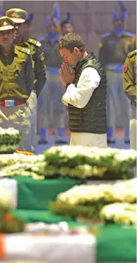  ??  ?? India’s Prime Minister Narendra Modi (left photo) and Congress president Rahul Gandhi (right photo) pay tribute to the 40 Central Reserve Police Force (CRPF) troopers who were killed in Kashmir.