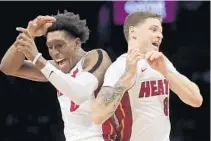  ?? FRANK FRANKLIN II/AP ?? Josh Richardson, left, Tyler Johnson, right, and the rest of the Heat turned a team meeting into a victory in Brooklyn.