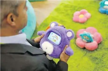  ?? JOHN LOCHER/AP ?? The US$149 Woobo is a talking robot is part of a new cottage industry of sociable toys. It can help set toothbrush­ing routines, play educationa­l games and answer complex questions.