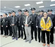  ?? Picture: CHINA NATIONAL NARCOTICS CONTROL COMMISSION VIA REUTERS ?? DRUG CRACKDOWN: People charged with smuggling fentanyl to the US stand during sentencing in Xingtai, Hebei province, China, on Thursday