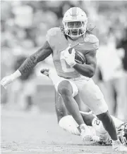  ?? BRIANNA PACIORKA/NEWS SENTINEL USA TODAY NETWORK ?? Tennessee running back Jaylen Wright, who has blazing speed with a 4.38 time in the 40-yard dash, averaged 7.4 yards per carry last season, closing with 1,013 yards rushing. He said he has run as fast as 23.7 mph.